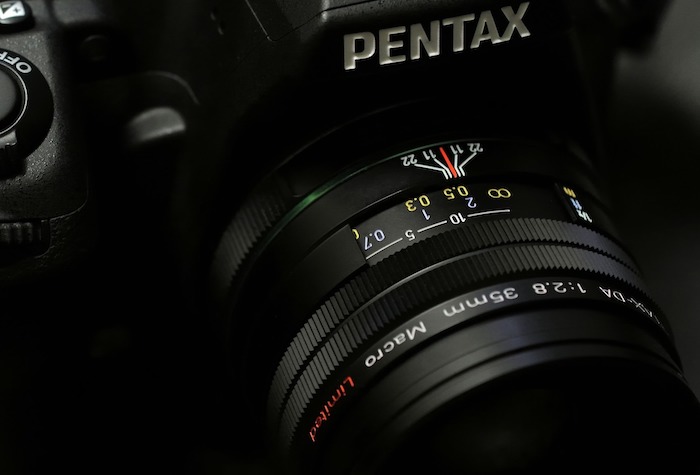 Close-up of Pentax brand camera and lens