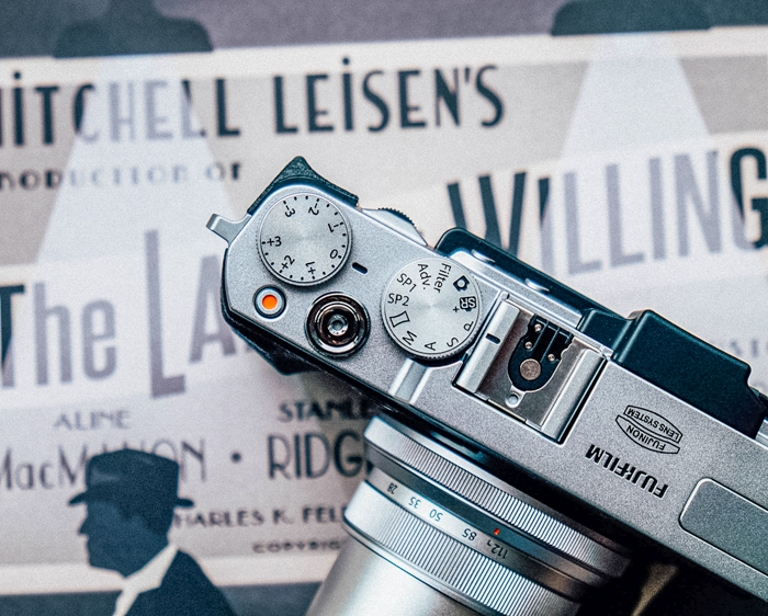 Fuji camera with a retro look on an old playbill