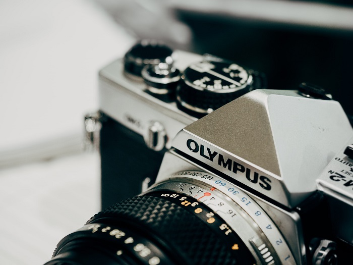 an up-close shot of a retro styled Olympus camera 