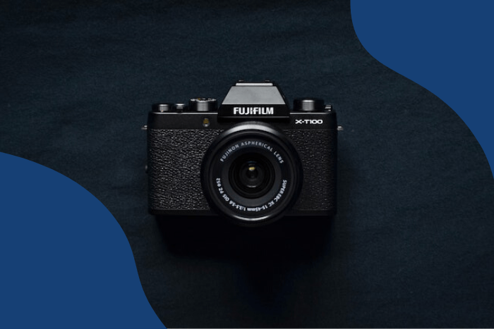 Flatly of compact FujiFilm brand point-and-shoot camera on a black background