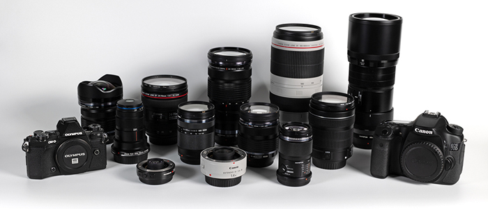 Photographic equipment lens and cameras isolated on white background