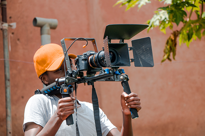 Man holding A7RIII with video accessories