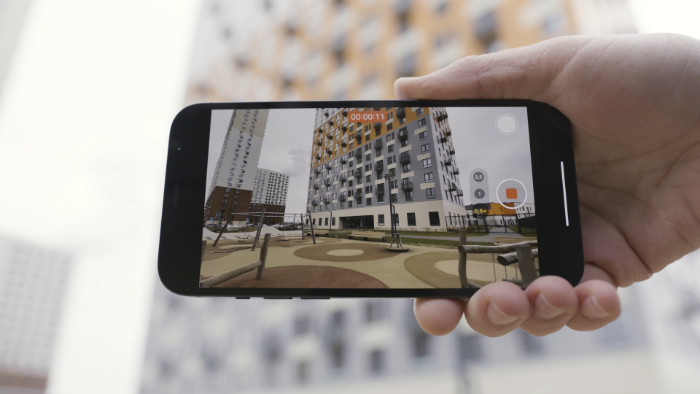 Mobile phone recording video in an urban setting