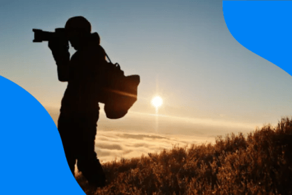 Silhouette of a professional photographer taking photos outdoors