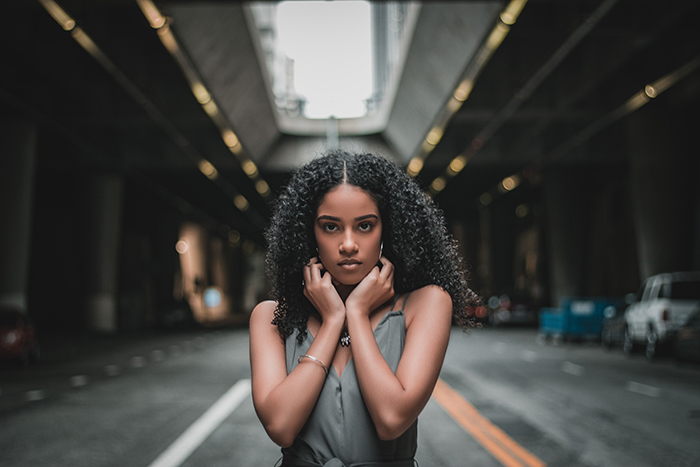 Urban portrait of a woman posing on a street