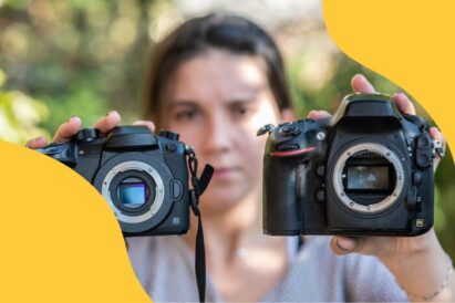 A girl holding mirrorless and DSLR camera with removed lenses and visible matrix.