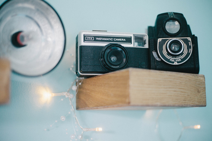  an old instamatic film camera with antique flash